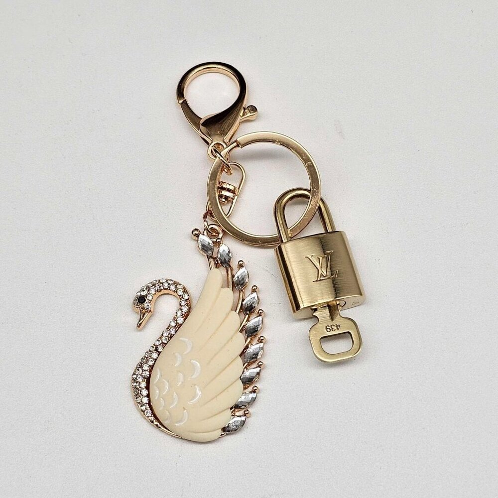 Authentic Louis Vuitton Lock & Key with unbranded Swan Bagcharm, Keycharm